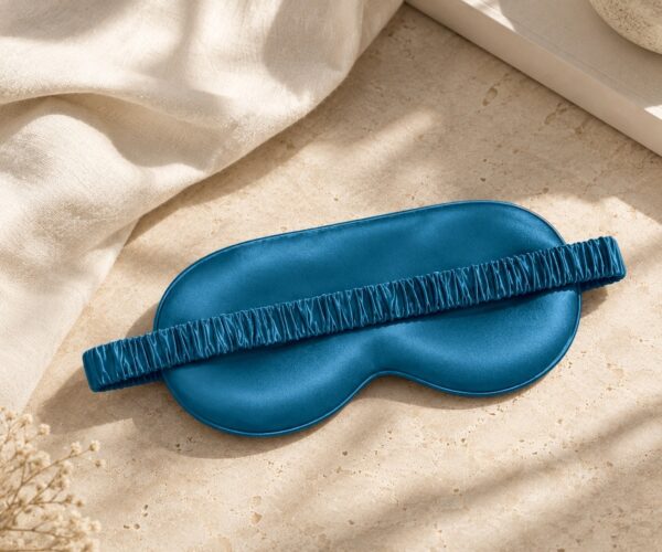 Peacock Blue Classic mulberry silk eye mask on linen and stone