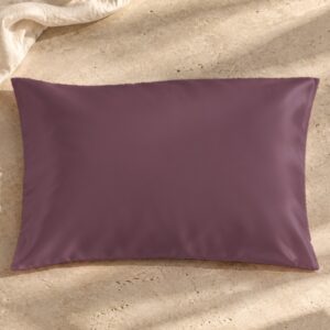 Grey purple mulberry silk pillowcase on sunlit stone
