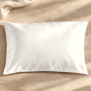 Ivory mulberry silk pillowcase on sunlit stone