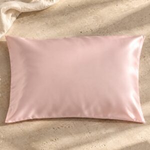 Blush pink mulberry silk pillowcase on sunlit stone