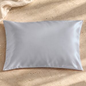 Silver mulberry silk pillowcase on sunlit stone