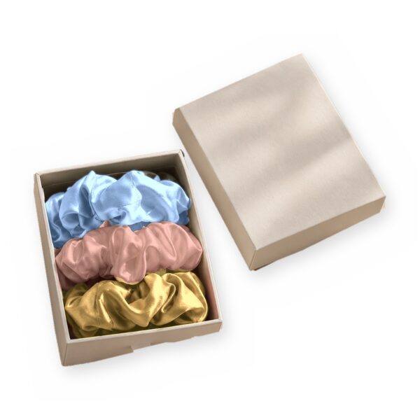 Curio Silk silk scrunchie gift box in baby blue gold rose gold on a white background