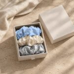 Baby blue, white and silver mulberry silk scrunchies in a white gift box