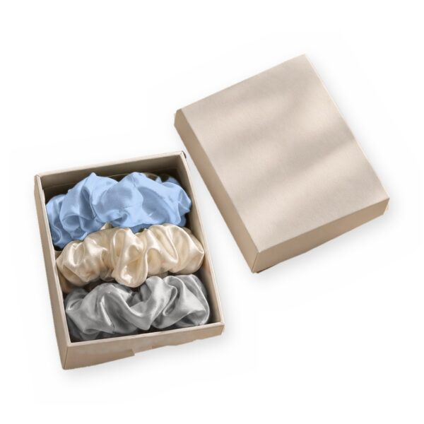 Curio Silk silk scrunchie gift box in baby blue silver white on a white background