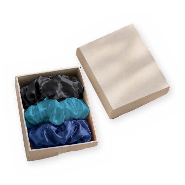 Curio Silk silk scrunchie gift box in black blue aqua on a white background
